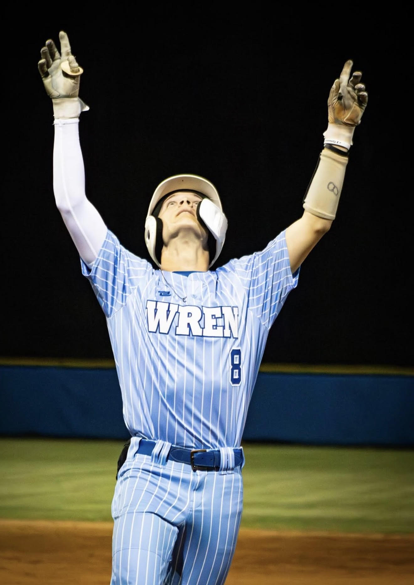 Wren baseball player celebrating after a hit